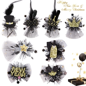 Detailed set of black and gold New Year party hair clips with crowns and champagne bottles