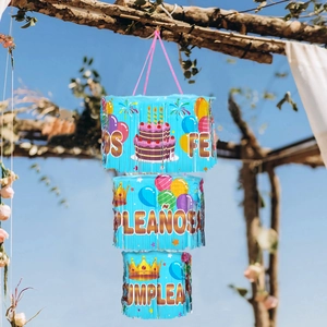 Three-tier blue birthday party hanging decoration with tassels and festive patterns