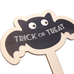 Halloween wooden bat trick or treat prop with rustic plywood texture and stick