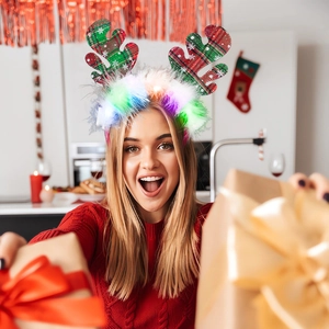 Christmas LED reindeer headband with red plaid antlers and glowing colorful pom-poms