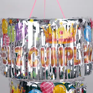 Detail of silver fringe curtain with Feliz Cumpleaños print and balloon patterns