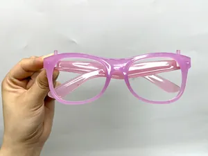 Detailed view of pink translucent luminous glasses frame with glitter for party and festivals