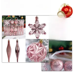 Pink Christmas ornaments set in transparent gift box featuring snowflakes and balls