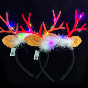 Set of two LED glowing Christmas reindeer antler headbands with colorful lights and white feathers