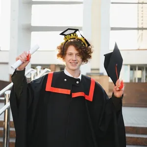 Graduation headband with gold GRAD letters and mini tassel cap for party celebrations
