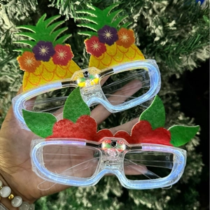 LED pineapple and tropical plant party glasses with glowing lights for Hawaiian beach event
