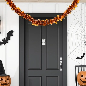 2m Halloween tinsel garland with pumpkins hanging on a black door for festive decoration