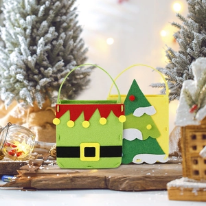 Christmas felt gift bags with green elf and snowy tree designs for holiday treats