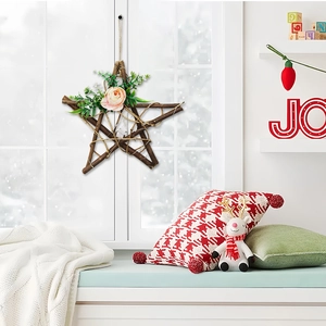 Pastoral rustic star wreath made of natural branches with pink rose and green leaves