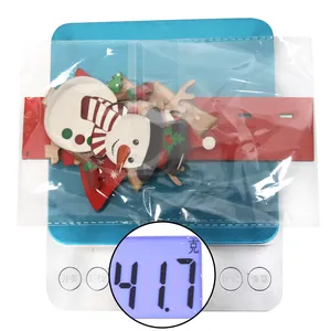 Close-up of DIY wooden Christmas ornaments on scale showing a total weight of 41.7g