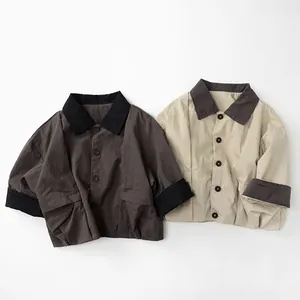 Detailed view of kids cotton linen shirts featuring contrast collars and button pockets