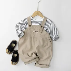 Kids khaki overalls with striped long sleeve shirt and Luck embroidery detail