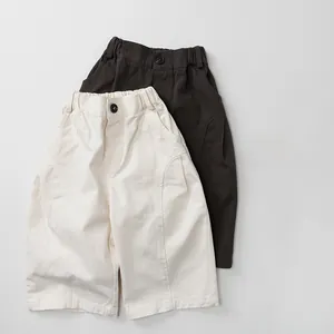 Detail of kids casual cotton twill shorts showing elastic waist and fine stitching