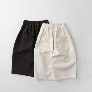 Casual wide-leg kids trousers in black and cream with elastic high waist and back pockets