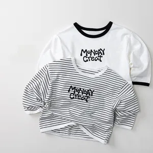 Detail of cotton kids striped long sleeve t-shirt with Monday Great print and ribbed cuffs