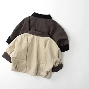 Detail view of cotton linen kids jackets with contrasting collar and cuffs