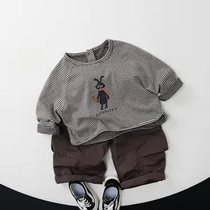 Detailed flat lay of children's striped cute rabbit sweatshirt and cargo pants set