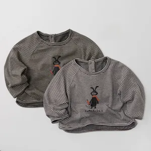 Close-up of soft cotton kids long sleeve t-shirts with striped pattern and rabbit graphic