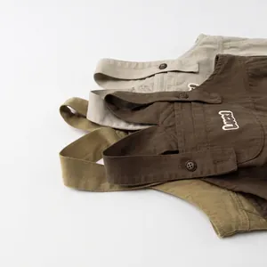 Kids cotton canvas overalls in beige, coffee, and green with 'Luck' embroidery