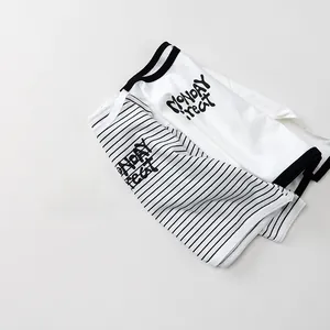Detail view of cotton kids long sleeve tees with Monday Treat print and striped design