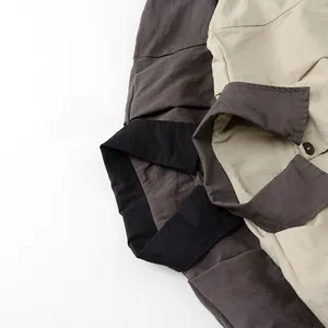 Detail of the contrasting collar and button design on the spring jacket for children