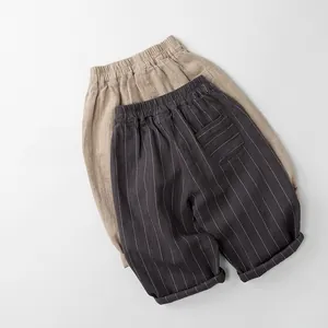 Détail du pantalon rayé en coton et lin pour enfants avec taille élastique et poche