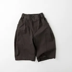 Detail of kids casual wide-leg cargo pants in charcoal grey with elastic high waist