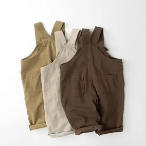 Kids cotton linen overalls in khaki, beige and brown with back pockets and folded cuffs