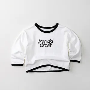Detail of soft cotton kids t-shirt with black ribbed neck and Monday Great print