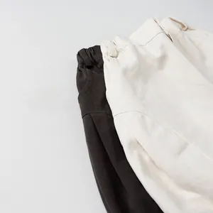 Detail of kids casual wide-leg trousers showing elastic waistband and cotton fabric texture