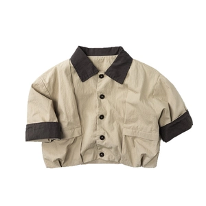 Kids vintage khaki jacket with contrasting brown collar and sleeves in minimalist style