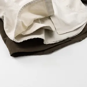 Detailed close-up of heavy twill fabric texture and durable double-stitched collar seams
