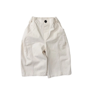 Kids cream wide-leg casual pants with elastic waist and black button detail