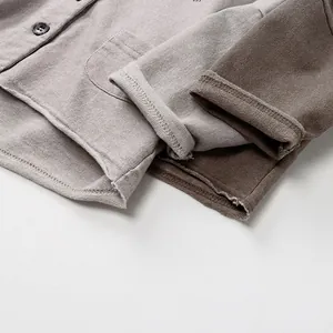 Grey and brown waffle knit long sleeve jackets for kids in a soft minimalist style