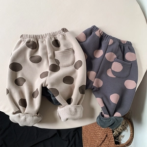 Detail of fleece lining and elastic high waist on polka dot toddler thermal pants