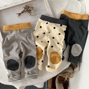 Detailed view of 3-pack baby knit leggings with striped patterns and reinforced knee pads