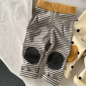 Detail view of cotton toddler striped leggings featuring grey knee patches and yellow waist