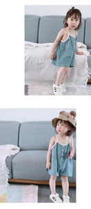 Detailed texture of baby floral romper with white trim and matching bear ear hat