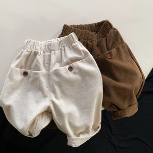 Kids corduroy casual loose pants in cream and brown with elastic waist and button detail