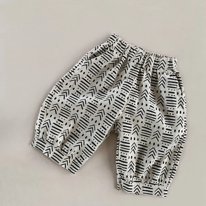 Detail of kids linen bloomers with geometric patterns and elastic waistband