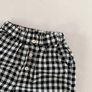 Pantalon large vichy pour enfants avec taille élastique et boutons décoratifs noir et blanc