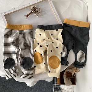 Three-pack of toddler cotton knit leggings featuring striped, polka dot, and solid grey styles