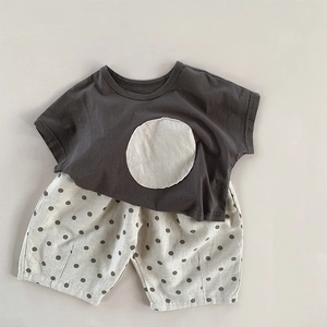 Kids minimalist summer set with dark grey t-shirt and polka dot linen shorts