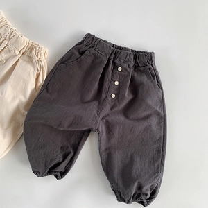 Detailed view of elastic waist and pocket on soft cotton linen kids' casual pants