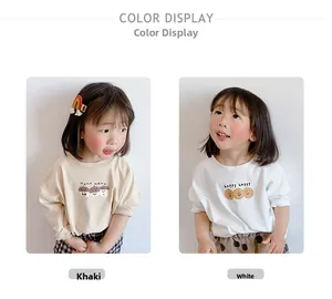 Detalle de camisetas de manga larga para niños con lindos estampados de bellotas y galletas