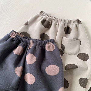 Fleece lined polka dot trousers for girls featuring thermal knit fabric and elastic waist