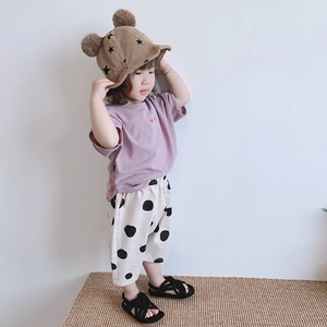 Girls summer outfit featuring purple T-shirt and beige polka dot wide-leg pants