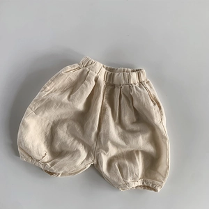 Detail view of cotton linen kids bloomers with elastic waist and textured fabric