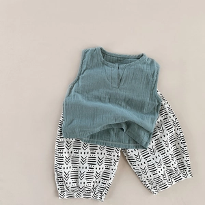 Detail view of baby cotton linen sleeveless top and geometric printed harem pants set