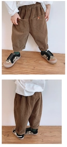 Detail of girls brown corduroy wide-leg pants paired with white tee and leopard shoes